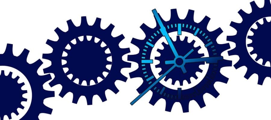 A series of connecting gears depicting processes - What is Process Improvement in Business