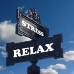 Cross road sign showing the words stress and relax