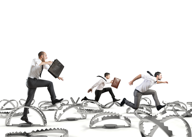 businessmen-running-over-jagged-obstacles - Challenges to Going Paperless