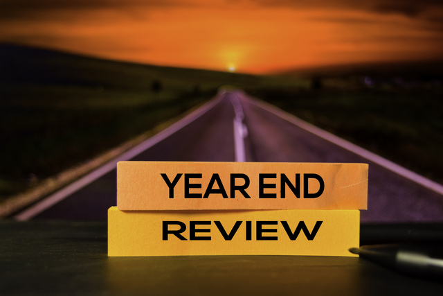 Year-end-review-on-the-sticky-notes-with-road-background - Business Strategy Review