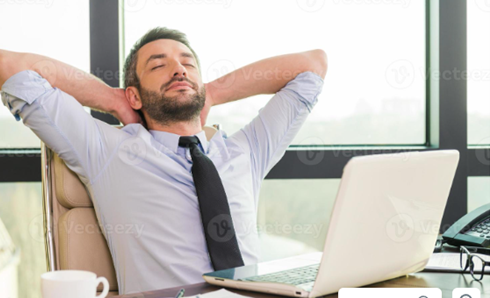 Man Taking a Break at his Office Desk - Simple Ideas to Increase Productivity