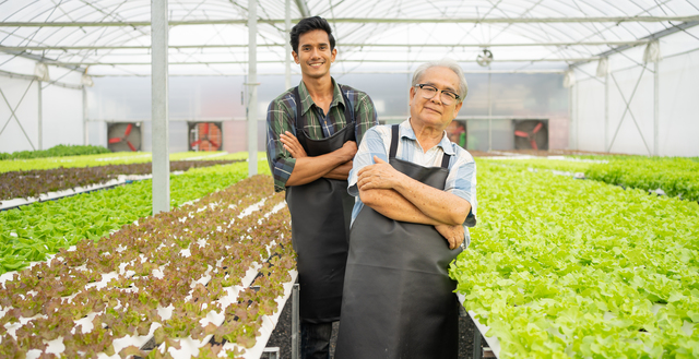 Senior-man-working-with-son-in-greenhouse-agriculture-small-business - Family Owned Business Problems