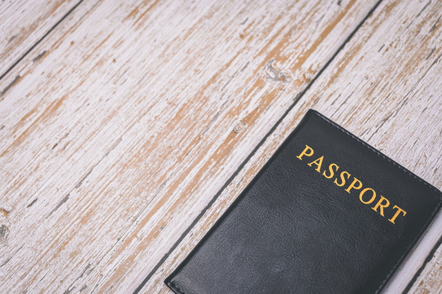 Passport on wooden tiled floor - Why a Clean Workspace is Important