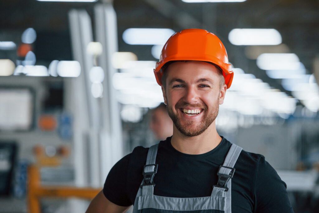 Construction small business technician with orange hard hat - Family Owned Business Strengths