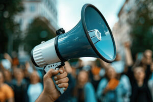 hand-of-man-holding-megaphone-illustrating-communication - How to Map a Business Process to Improve It