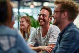 Group of business people laughing - 5 Practical Steps for Creating a Performance Evaluation Template that Works
